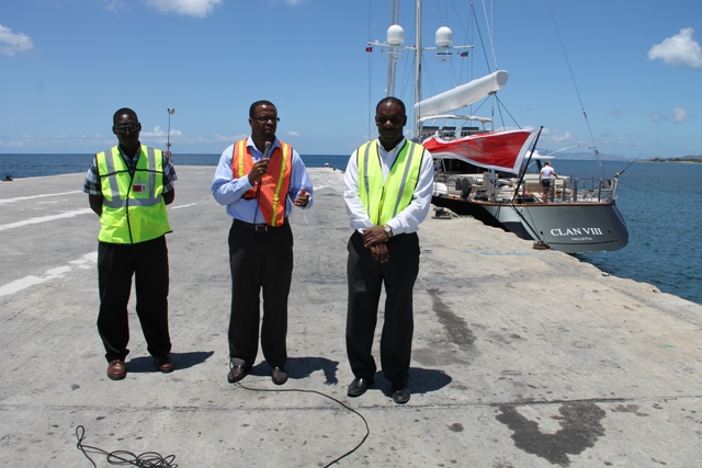 (l-r) Supervisor of Security at the Nevis Air and Sea Ports Authority (NASPA) Simeon Prentice , Deputy Premier and Minister of Tourism in the Nevis Island Administration Hon. Mark Brantley and Chairman of NASPA Colin Dore at the Long Point Pier with Super Yacht CLAN VIII Valletta on April 03, 2014